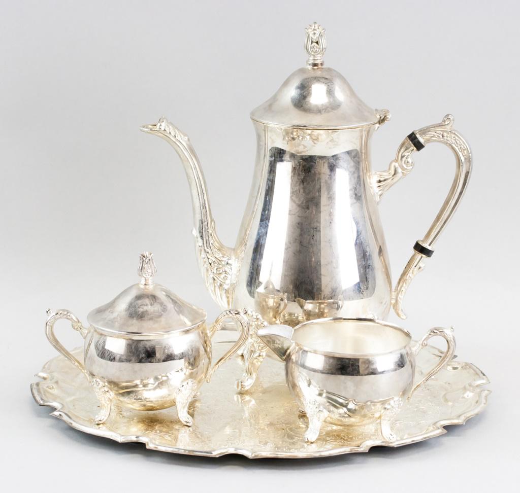 Set of Four Silvered Tea Set: Set of four (4) silvered tea set, with teapot, sugar bowl, milk bowl, and tray. 24 x 31 cm. 1,846 grams. Metal untested.