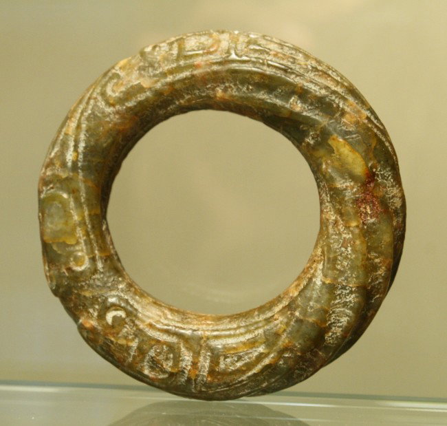 Ring-shaped jade carved in a twisted pattern, gre: Ring-shaped jade carved in a twisted pattern, green color, Han Dynasty, D: 2 3/8",H:3/4".rare older piece in excellent condition.