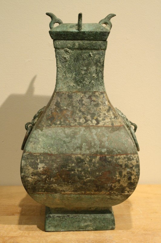 Archaic Chinese bronze jar with animal head handles: Archaic Chinese bronze jar with animal head handles and lid H: 13