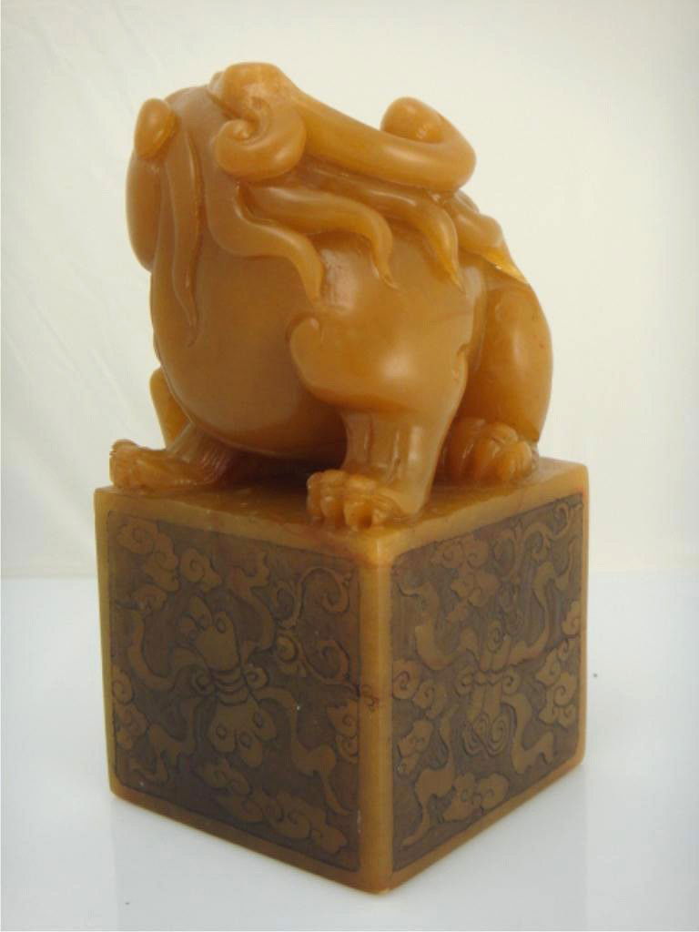 Large Carved Shoushan Tianhuang Fu Lion Seal: LARGE CARVED SHOUSHAN TIANHUANG FU LION SEAL Large Chinese shoushan Tianhuang stone seal; of square form surmounted with an openwork fu lion and cub; low relief decorative carvings on square base 6" t