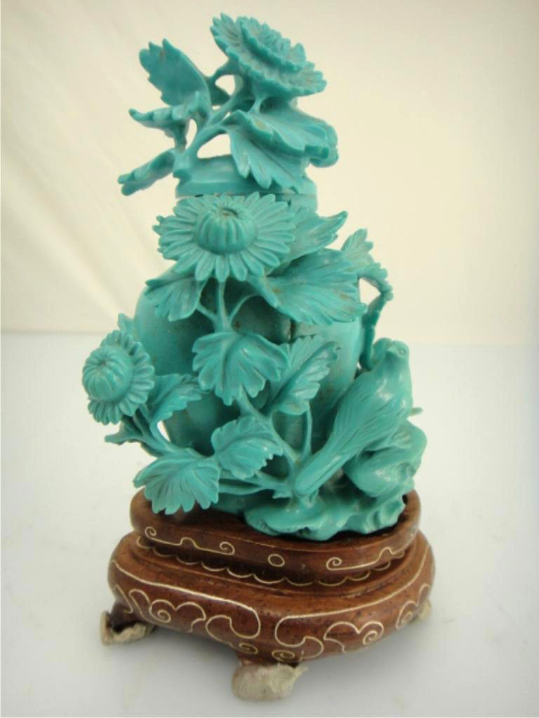 Chinese Turquoise Vase with Carvings: CHINESE CARVED TURQUOISE VASE Elaborately carved Chinese turquoise stone vase; depicting flowers and birds in relief; with lid on Beijing copper thread stand and glass display case 4 1/4" tall (with s