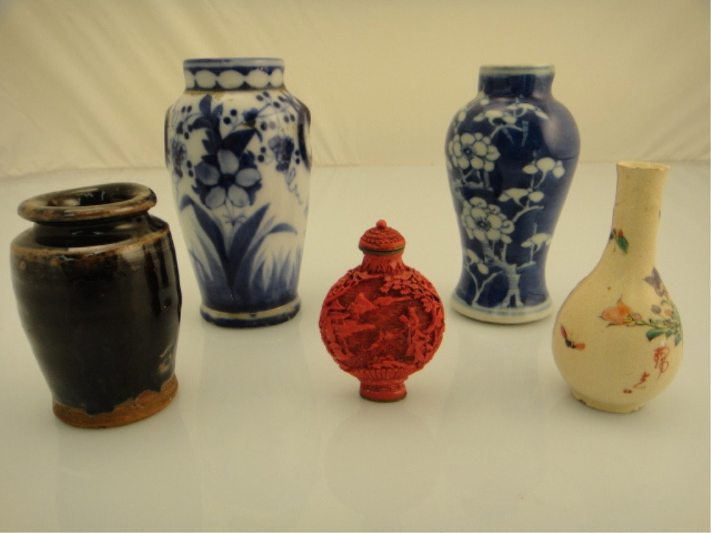 Five Chinese Pieces: Snuff Bottle and Small Vases: FIVE CHINESE PIECES: SNUFF BOTTLE AND SMALL VASES Collection of five, Chinese snuff bottle and porcelain bottles including: one brown porcelain bottle; one red lacquer snuff bottle Inscription / Seal: