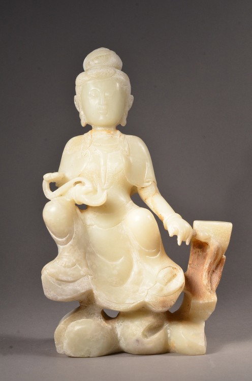 Chinese White Jade Figure of Buddha: Chinese white jade figure of seated Buddhist; holding a scepter; light brown suffusions;11" tall, 7" wide, 3" deep. 2800 grams