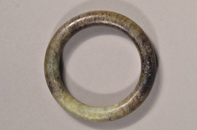 Chinese Dark Jade Bangle: Very old Chinese jade bangle; of uneven dark suffusion; 3 1/2" diameter, 92 grams