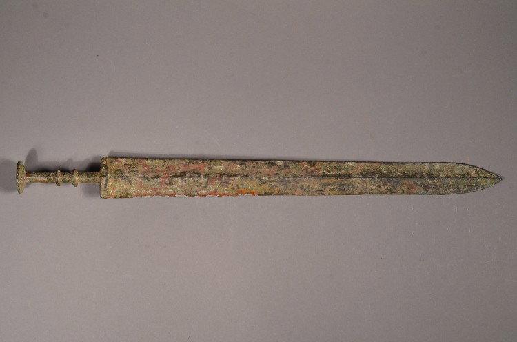 Rare Early Zhou Bronze Sword Incised Script Mark: Rare Chinese early Zhou Dynasty bronze sword; long tapering blade; hilt with two circular flanges above circular dished pommel; incised eight-character script mark; L: 47 cm