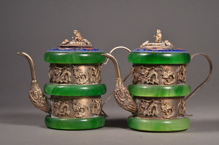 Pair Dragon Silver Pot Wrapped in Bangles: Pair of silver pots with jade bangles; the body wrapped in three bangles; between the bangles featuring carved dragon motif; the lid surmounted by monkey; mark stamped on base; H: 11 cm, D: 8 cm