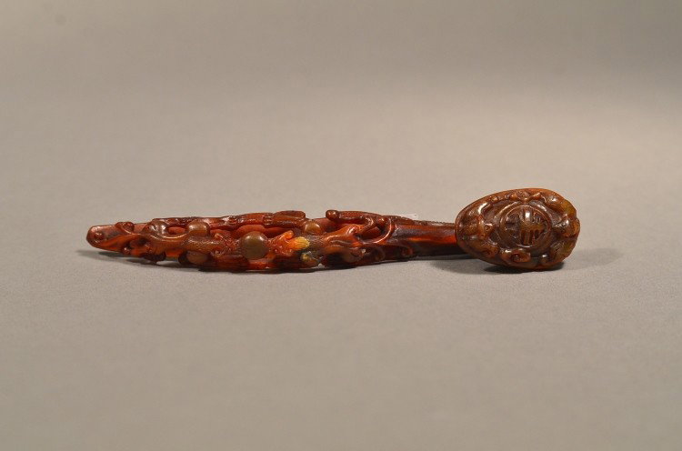 Openwork Carved Cow Horn Ruyi Scepter Chilong Bat: Finely carved and detailed, small Chinese ruyi cow horn scepter: head with Shou longevity symbol with pair of antithetical bat design; body featuring pair of antithetical chilong alongside openwork ca