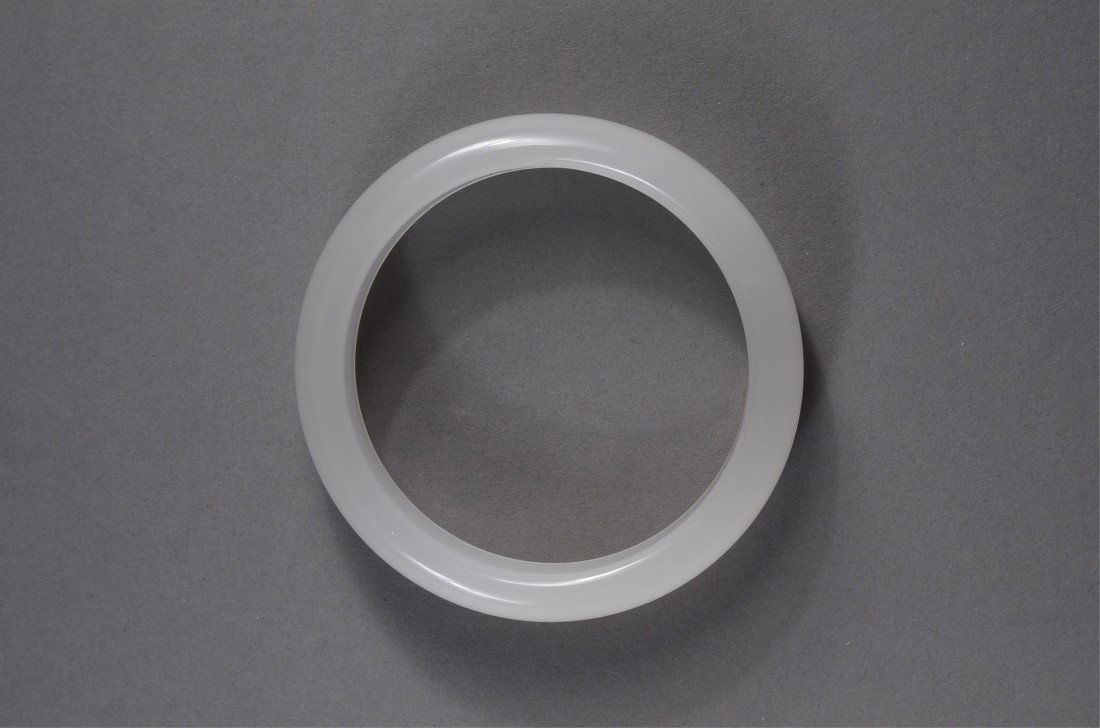 Translucent White Chinese Carved Jade Bangle: Chinese jade bangle; of translucent white colouration; D: 7 cm, 53 grams