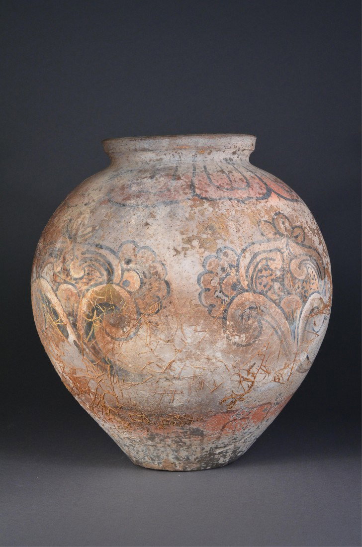 Rare Han Dynasty Pottery Vase: Rare Chinese Possibly Han Dynasty pottery vase; with repeating floral motifs around the body and the neck; petrified pieces of vegetation stuck to the vase (normal wear and tear for piece of the age);