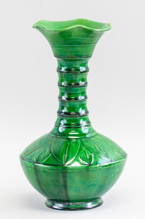 Chinese Green Carved Lobed Vase: Chinese carved vase. Of green color. With lobed opening, ridged neck, and lotus pod-like body, resting on short foot rim. 25 x 15 cm, 775 grams