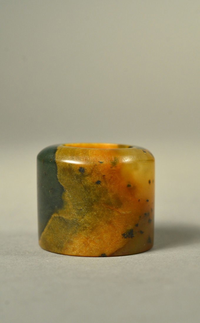 18th/19th Century Chinese Brown Archer's Ring: Chinese carved brown jade archer's ring; with dark suffusions throughout, 18th/19th Century; D: 4 cm, H: 3 cm, 45 grams