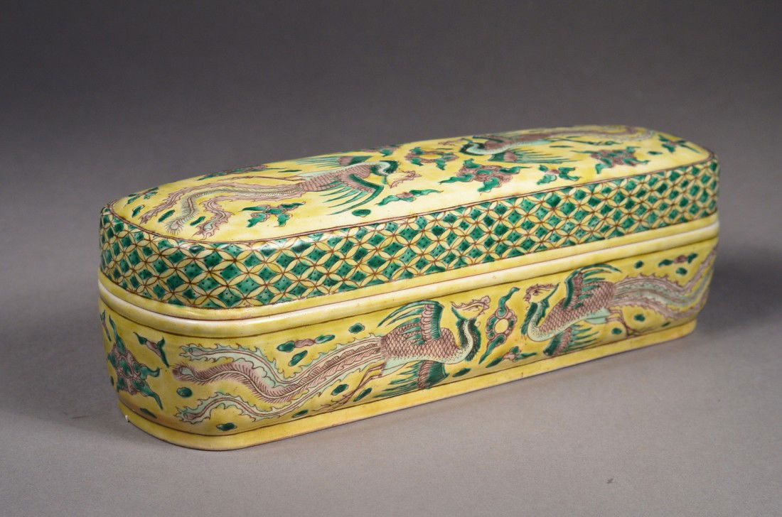 Rare Chinese Wucai Porcelain Brush Box & Cover: Rare Wucai enameled porcelain brush box and cover; domed cover, base, and sides painted with paired five-clawed red dragons chasing flaming pearls opposite flying phoenix; the interior of cover and ba