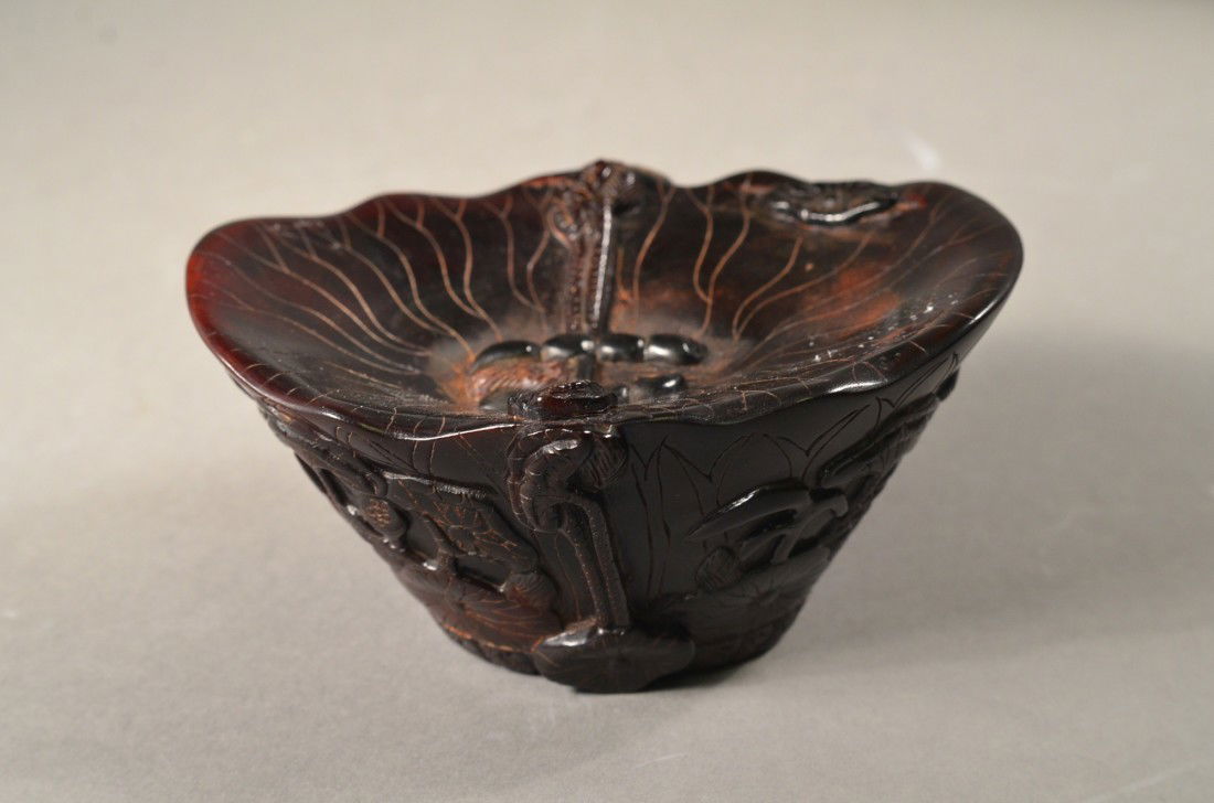 Archaistic Chinese Horn Libation Cup: Archaistic Chinese carved horn libation cup; featuring lingzhi, crane, and fish auspicious design in relief; H: 6 cm, L: 13 cm, W: 10 cm