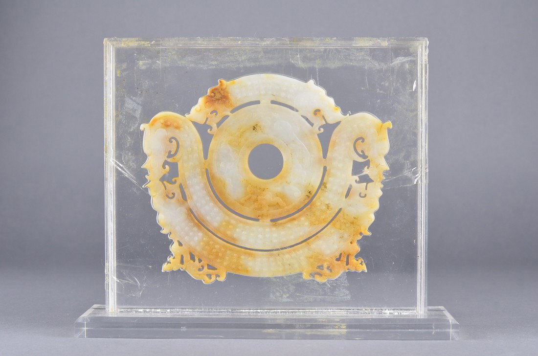 Archaic Chinese Han Dynasty White Jade Bi Dragon: Archaic Chinese Han Dynasty carved jade ritual bi disc; flanked by dragons in relief; the stone of white tone with some russet suffusions; L: 17 cm, W: 13 cm, 1271 grams (total)