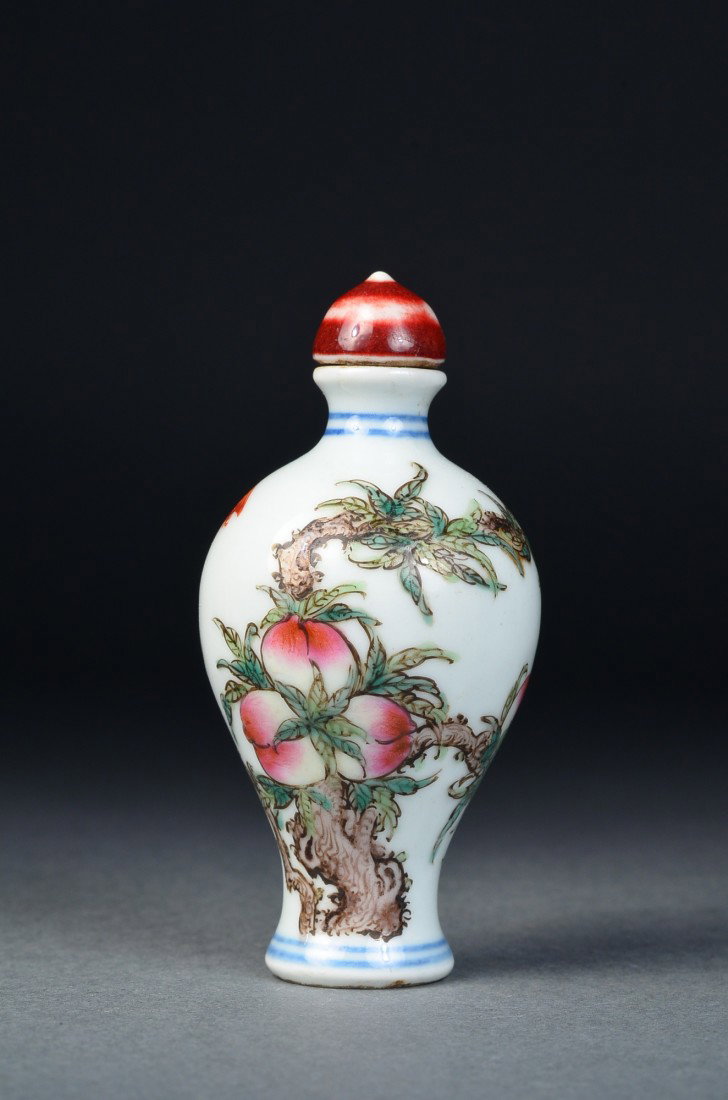 Chinese Porcelain Snuff Bottle Peach & Bats Mark: Well hollowed and finely decorated Chinese porcelain snuff bottle; ovoid baluster form body featuring auspicious peaches borne on branches and fu bats; double circle mark on base, matching red glazed 