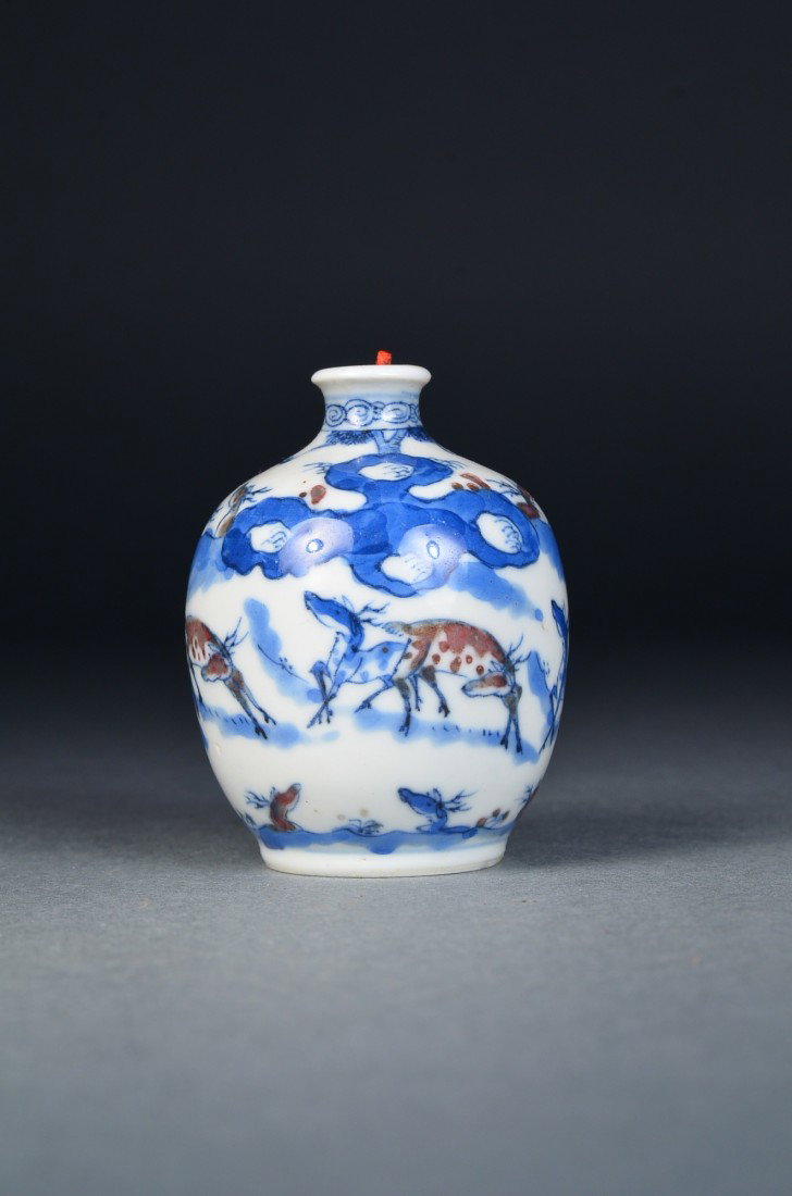 Chinese Blue & White Snuff Bottle Yongzheng: Chinese blue and white porcelain snuff bottle; globular body featuring bleu and white design of deer with brown enameling; six-character Yongzheng Mark on base; H: 6 cm, D: 4 cm