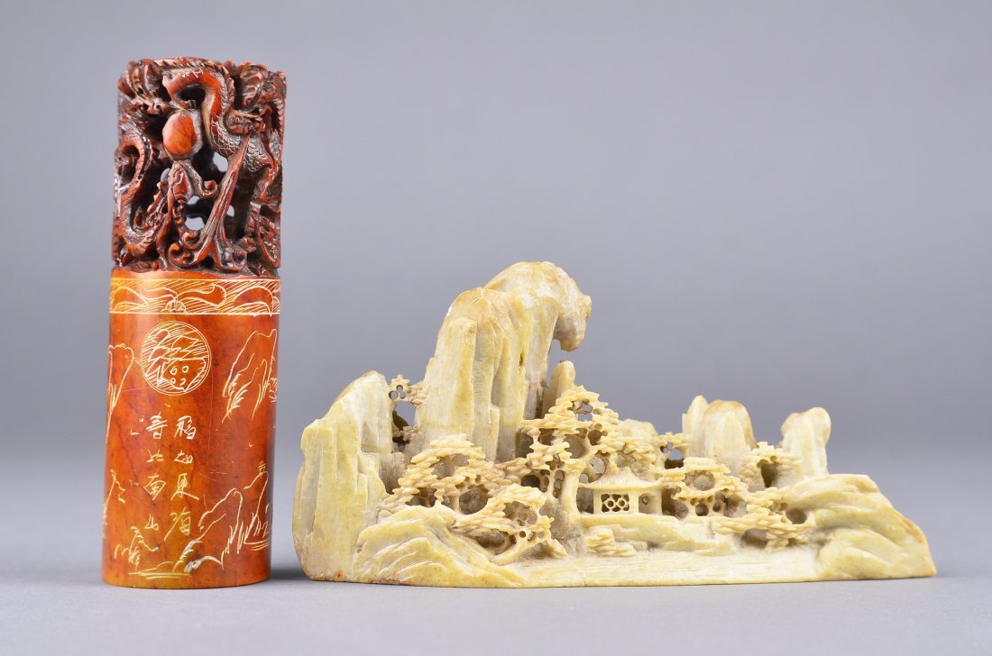Set of Two Soapstone Carved Boulder & Seal: Set of two Chinese soapstone carved boulder and seal block; the seal of cylindrical form featuring incised designs, the top featuring openwork dragon finiale; carved boulder featuring landscape scene 