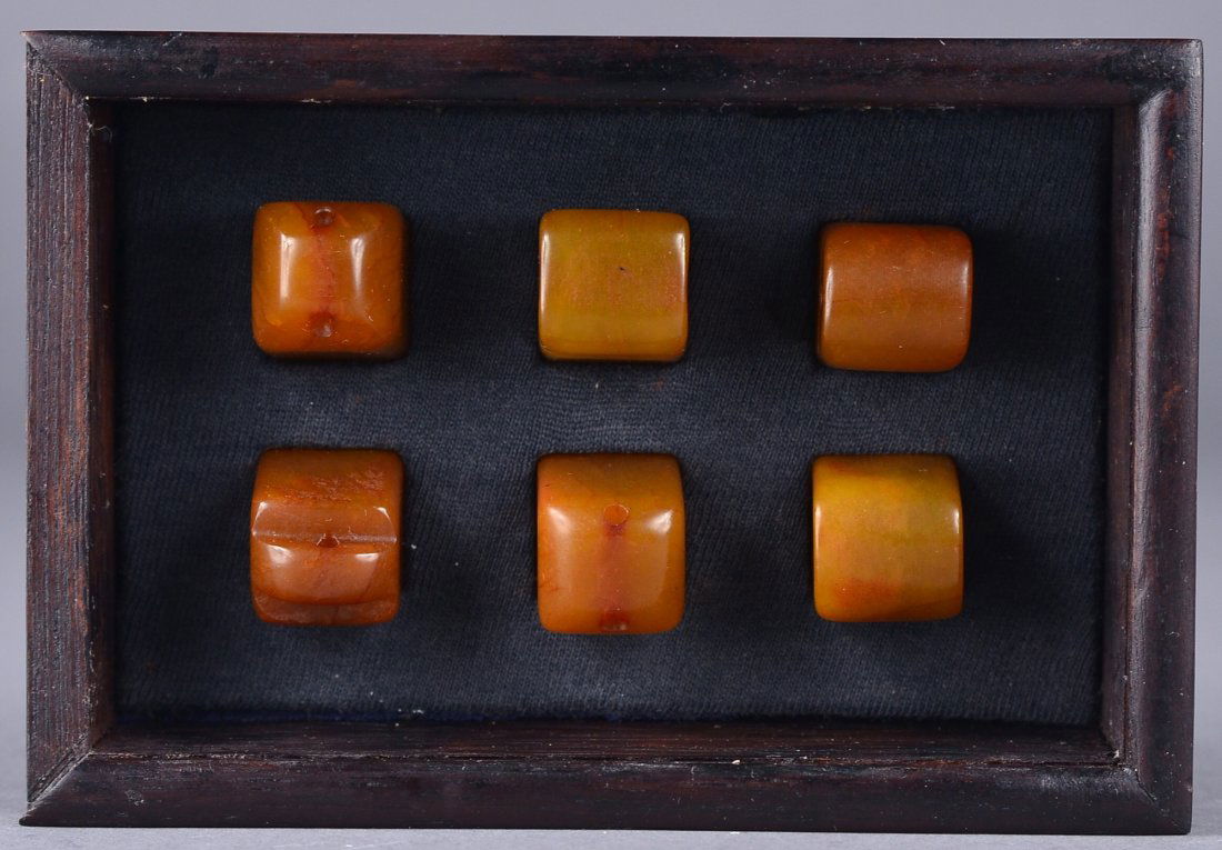 Set of Six Chinese Carved Tianhuang Stone Seals: Set of six Chinese carved Tianhuang stone seals; of various rounded forms featuring notched handles; incised mark on one side of all six seals; the stone of rich toffee tone; H: 2 cm, 13 grams (approx