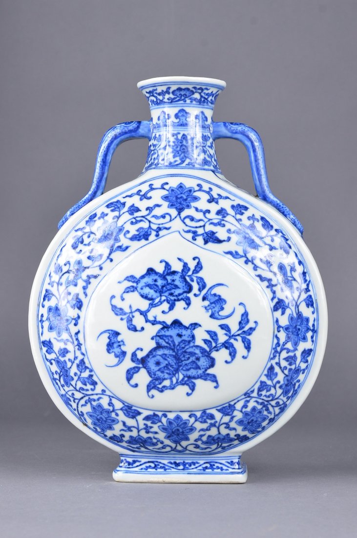 Chinese Blue & White Moon Flash Qianlong: Chinese blue and white moon flask; peach shaped panel enclosing bats flying atop peach branches, reserved on lotus stroll ground; ruyi handles resting on both shoulders; six-character Qianlong mark on