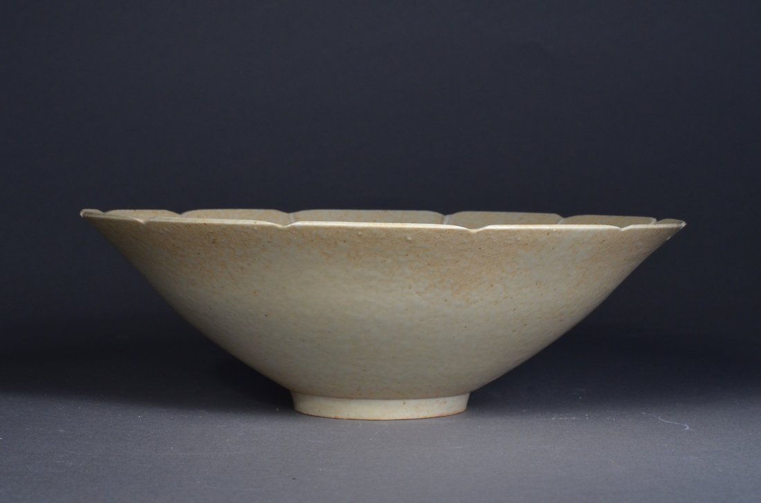 Chinese Celadon Bowl Fish Foliate Design: Chinese celadon glazed porcelain bowl; shallow form with foliate design and fish motif; base unglazed; H: 8 cm, D: 22 cm
