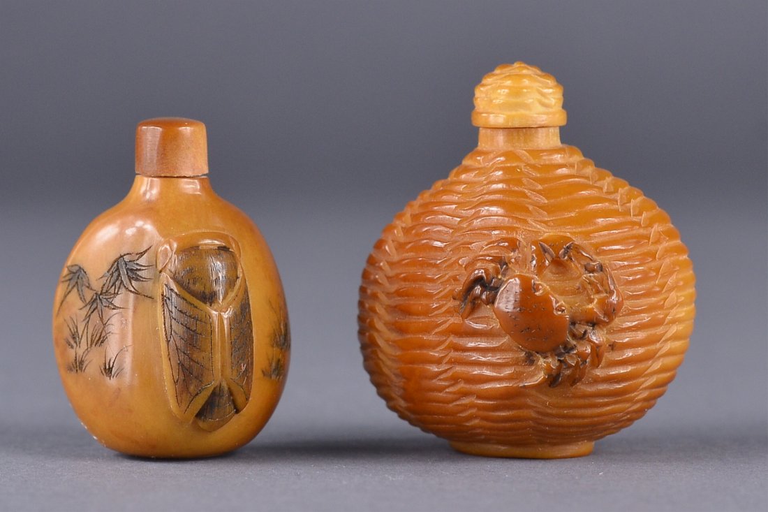 Set of 2 19th C. Olive Stone Carved Snuff Bottles: Set of two Chinese olive stone carved snuff bottles; on featuring ribbed design with crabs in relief; the other featuring finely incised bamboo stalks; incised artist's mark on body with cicada in rel