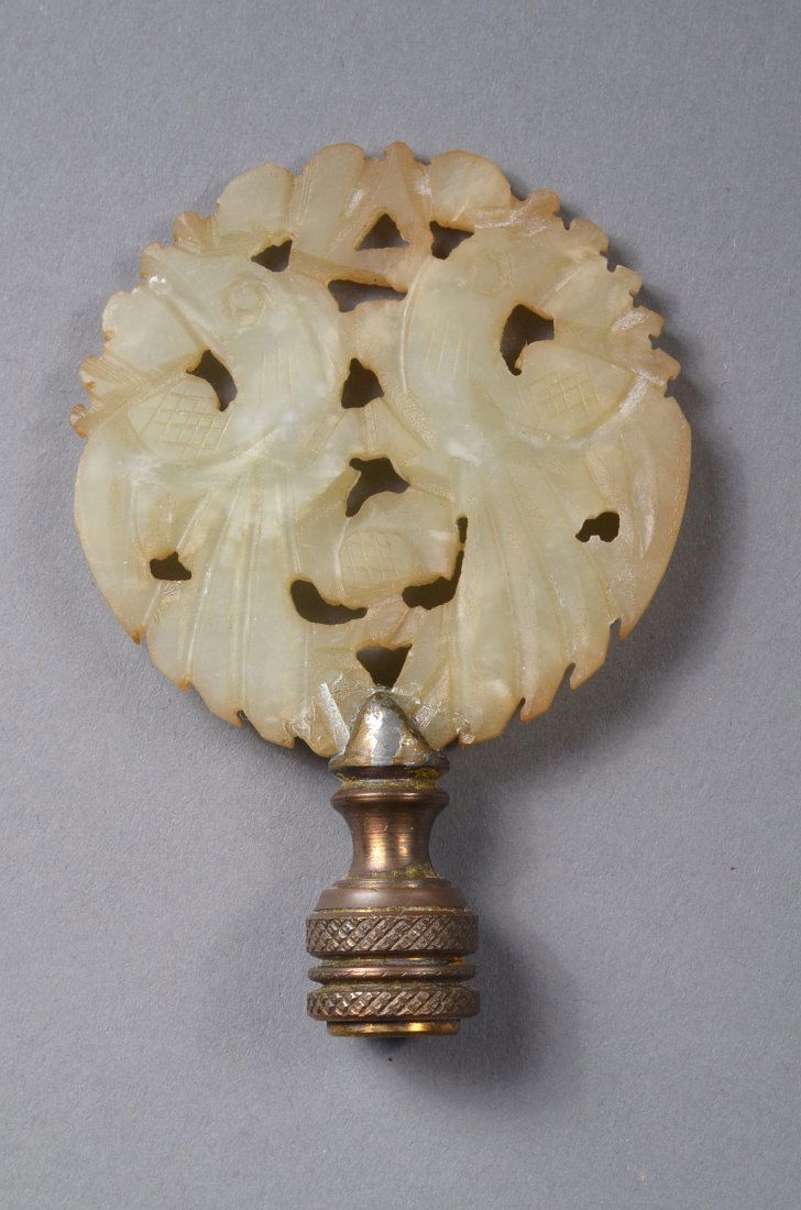 Chinese White Jade Phoenix Piece: Chinese carved jade piece; circular pendant form featuring phoenix in openwork design; the stone of translucent white tone; D: 5 cm, 34 grams