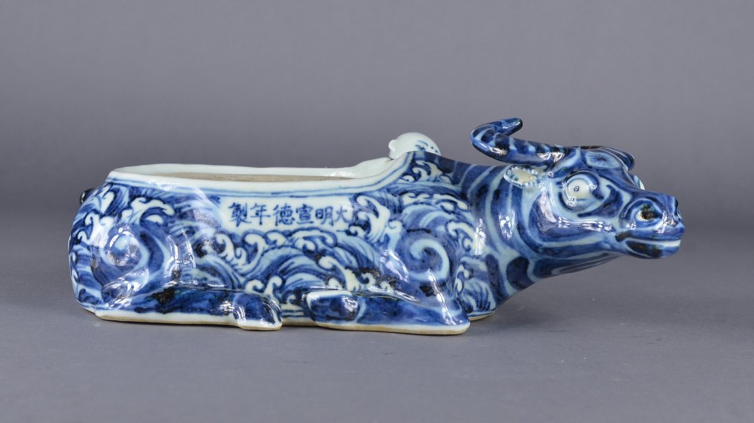 Chinese Blue & White Ink Brush Rest Ming Xuande: Chinese blue and white porcelain ink brush rest; in form of ox with molded boys hanging alongside ox; six-character Ming Xuande Mark on base; L: 25 cm, W: 14 cm, H: 8 cm