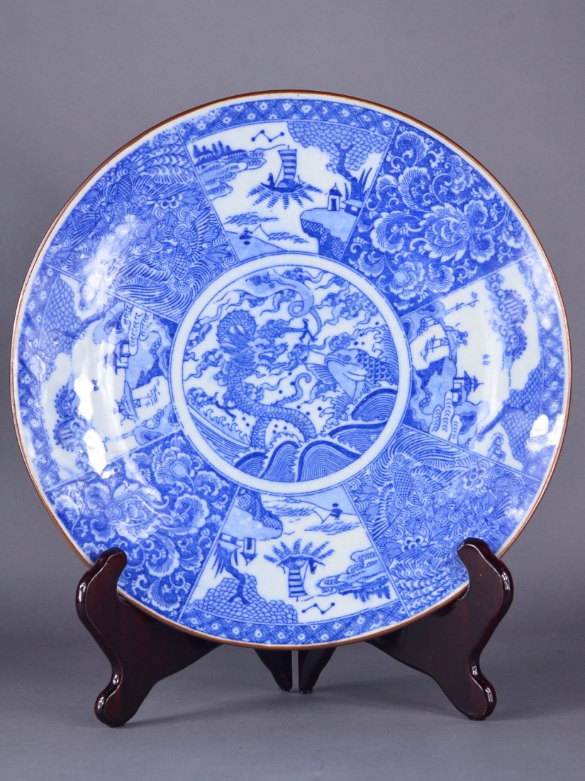 19th C. Chinese Blue & White Porcelain Charger: 19th Century Chinese blue and white porcelain charger; featuring landscape scenes; the centre featuring five-toed dragon; brown rim; Jian Ding Export Seal stamp; D: 31 cm