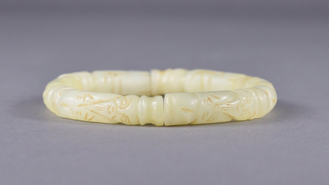 Chinese Carved White Hetian Jade Bracelet: Chinese carved Hetian jade bracelet; six pieces carved in form of Old Man with features in relief; the stone of translucent white tone; L: 3 cm (each bead), 36 grams
