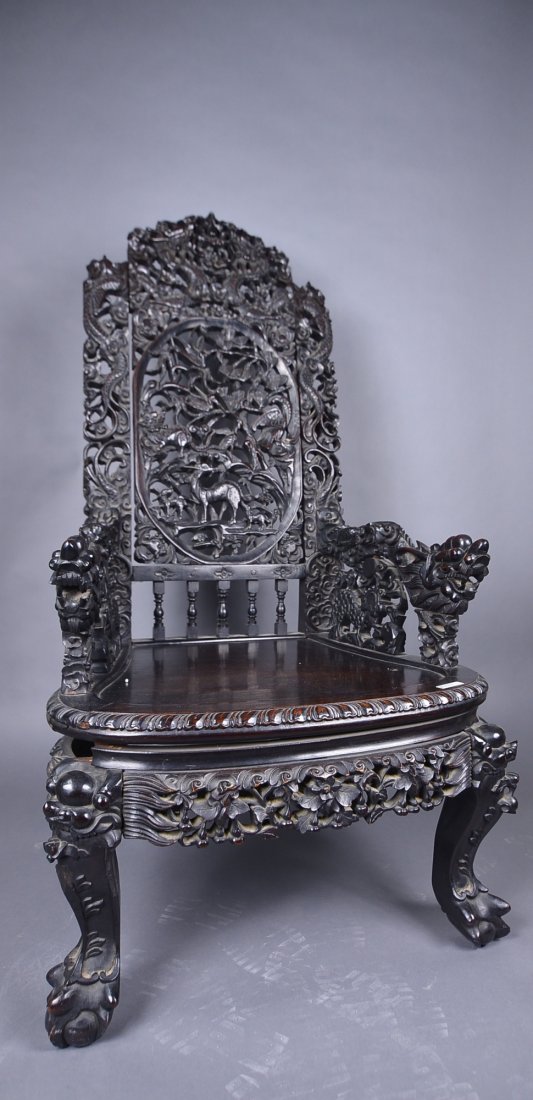 Intricately Carved 18th C. Chinese Zitan Chair: 18th Century Chinese Qing Period carved zitan chair; intricately carved with dragons, phoenix, lions and deer; non-lacquered genuine zitan wood; H: 113 cm, L: 60 cm, W: 55 cm; this lot has been relist