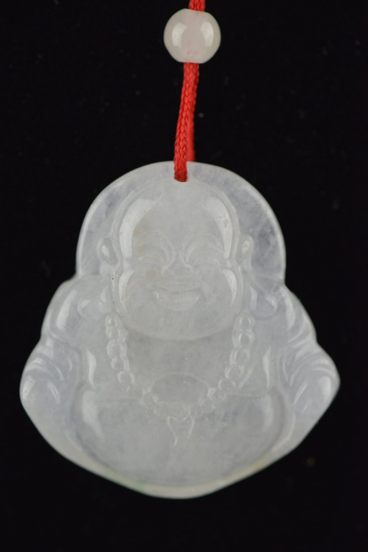 Set of Two Chinese Carved Jadeite Buddha: Set of two Chinese carved jadeite pendants; both featuring Laughing Budai in relief; the stone of translucent white and apple green tone; L: 3.5 cm, W: 3.25 cm, 20 grams (each)