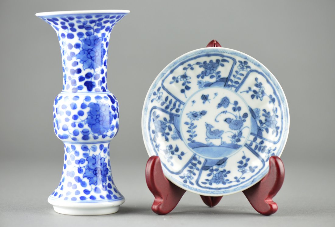 Chinese Kangxi Mark & Period Beaker & Dish: Chinese Kangxi Period blue and white porcelain beaker vase and dish; artemisia leaf mark on base of beaker vase; stick: Ca Mau Bing Thuan Sotheby's UNICOM sticker on base; H: 16 cm, D: 7 cm (beaker va