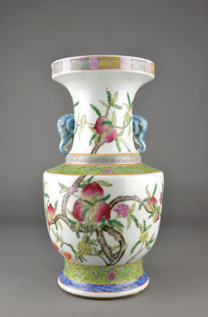 Chinese Famille Rose Porcelain Peach Vase: Chinese Famille Rose enameled porcelain vase; of baluster form with broad shoulders featuring peaches borne on branches between two registers of classic scroll on yellow ground; underneath everted rim