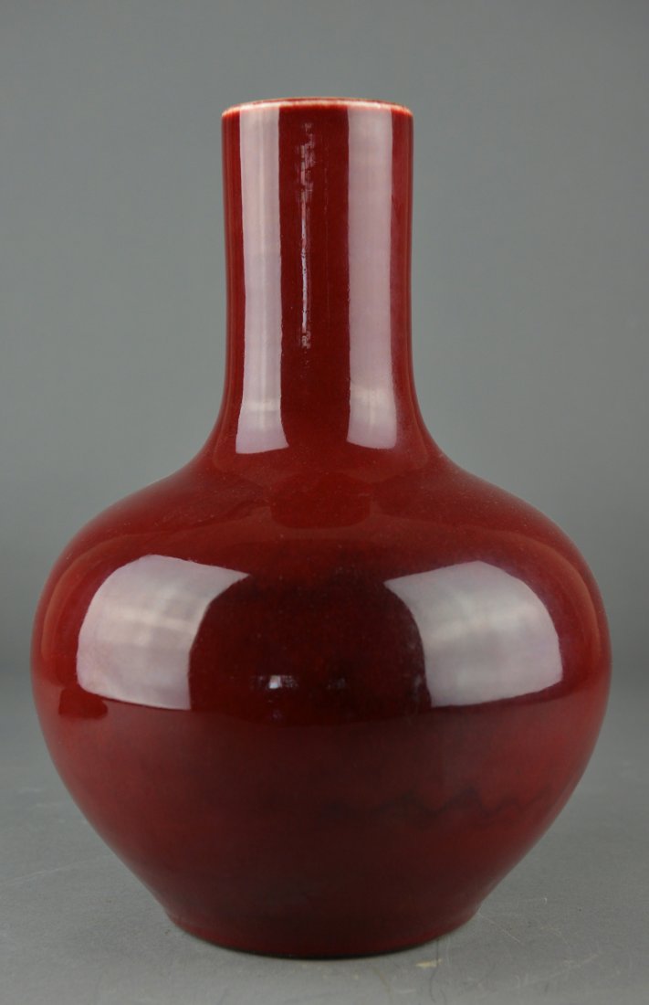 Chinese Flambe Sang de Boeuf Glazed Vase Yongzheng: Chinese Sang de Boeuf glazed porcelain vase; ovoid body covered with deep copper red glaze; four-character Yongzheng Mark on base; H: 32 cm, D: 20 cm