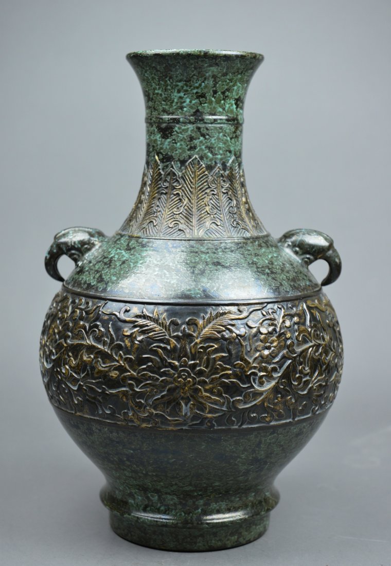 Rare Chinese Bronze Vase Elephant Head Qianlong: Rare Chinese bronze vase; pear-shaped body featuring formalized lotus spray borne on undulating scroll; alternating overlapping plantain leaves and pendant trefoil-shaped ruyi heads underneath flared 