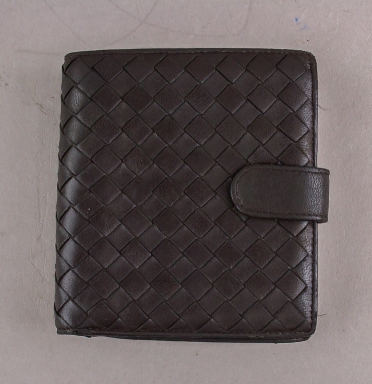 Bottega Venetta Leather Wallet Intrecciato Weave: Bottega Venetta bi-fold wallet of dark brown leather with with signature intrecciato weave; it has a zipped compartment for coins. Serial number: 114073 V0013 2040. 11 x 12 cm, 94grams