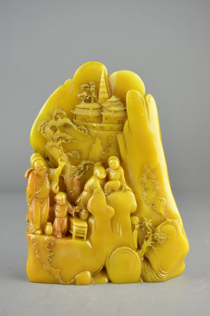 Chinese Carved Soapstone Boulder: Chinese carved soapstone boulder; featuring sages in landscape scene in relief; the stone of light honey tone; H: 22 cm, W: 16.5 cm, 1815 grams