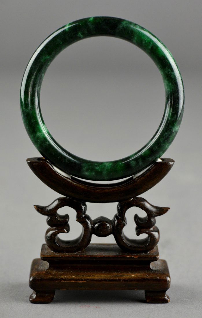 Two (2) Chinese Carved Spinach Green Jade Bangles: Set of two (2) Chinese carved jade bangles; the stone of dark spinach green tone; D: 7.5 cm, 67 grams (approx.)