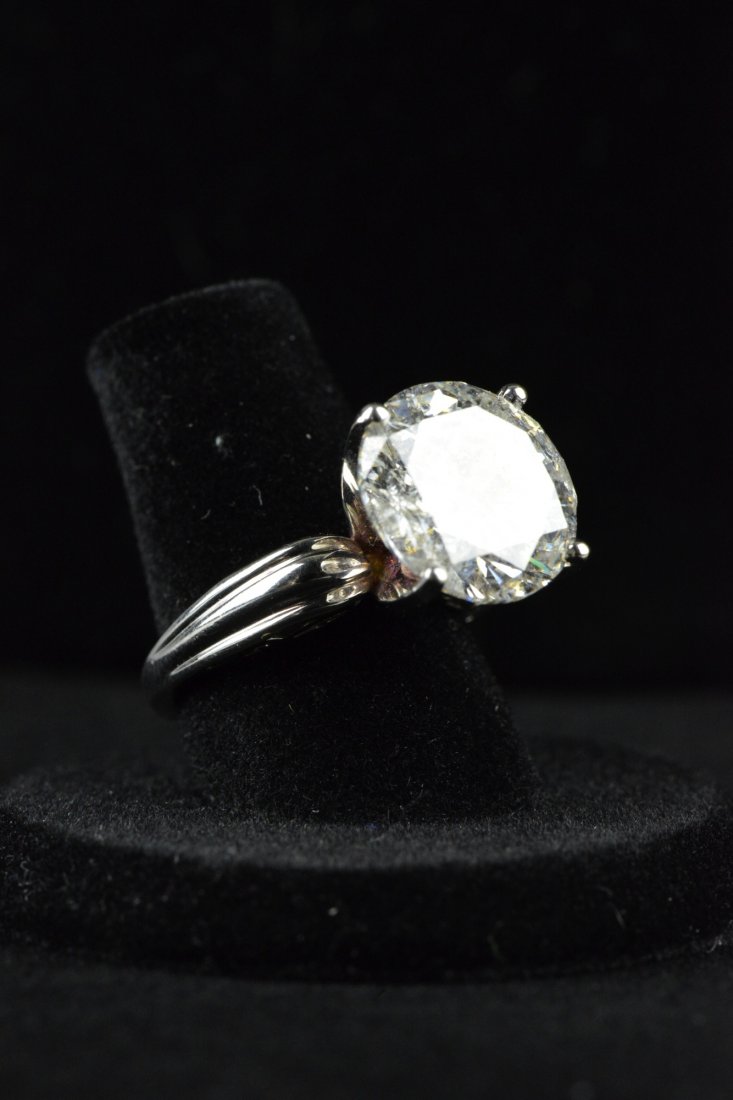 14K White Gold Ladies 9.58 ct Diamond Ring: 14K white gold ladies solitaire 9.58 carat diamond ring; one round brilliant cut diamond; estimated quality grades: I-1 Clarity, G Colour, Good Cut; total weight of ring 7.6 grams by scale; appraised 