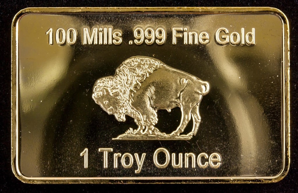 1 oz Gold Plated Bullion: Gold Plated Bullion. American gold bullion. Stamped "1 GOLD BULLION / UNITED STATES OF AMERICA / IN GOD WE TRUST" on obverse. Stamped "100 Mills .999 Fine Gold / 1 Troy Ounce" stamped on reverse. 28.1