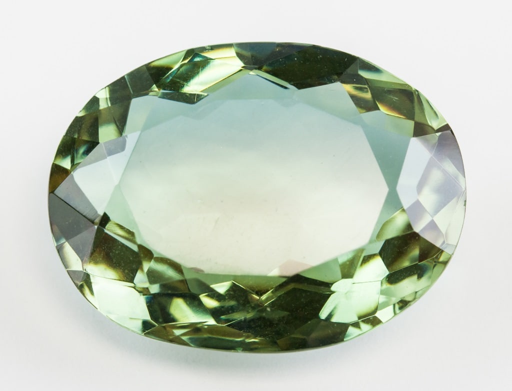 48.25ct Oval Cut Brown/Purple Alexandrite Gem GGL: One (1) 48.25 ct oval cut brown to purplish alexandrite gemstone. 29.13 x 22.21 x 11.47 mm. Accompanied with GGL certificate.