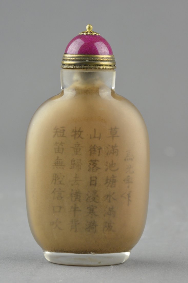 Peking Glass Snuff Bottle Reverse Painted: Chinese snuff bottle with cap; handle painted from the inside; painted head of a man and Chinese calligraphy; H: 10, D: 4.5