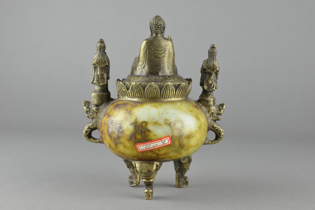 Jade Censer w/ Buddha Bronze Lid & Legs Qianlong: Chinese carved jade censer; of globular body with bronze handles and legs carved as Buddha, deities and dragons; gilded gold calligraphy on light brown jade body; bottom marked Qianlong; H 19 cm, D 12