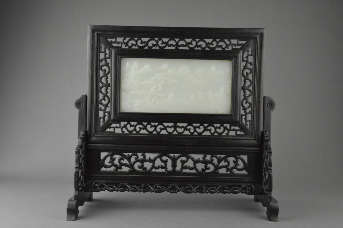 Chinese Jade Table Screen Reticulated Frame: Chinese table screen with reticulated rosewood frame and white jade inset. Jade inset features landscape scenery with mountains and cypress tree
