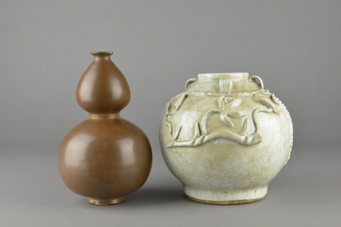 Set of Two Chinese Porcelain Jars: Set of two Chinese porcelain jar; one of gourd shape painting brown; H 19 cm, D 10 cm; another in robust form with white glaze with natural aged cracks; body with lotus and vines forms; H 16 cm, D 15