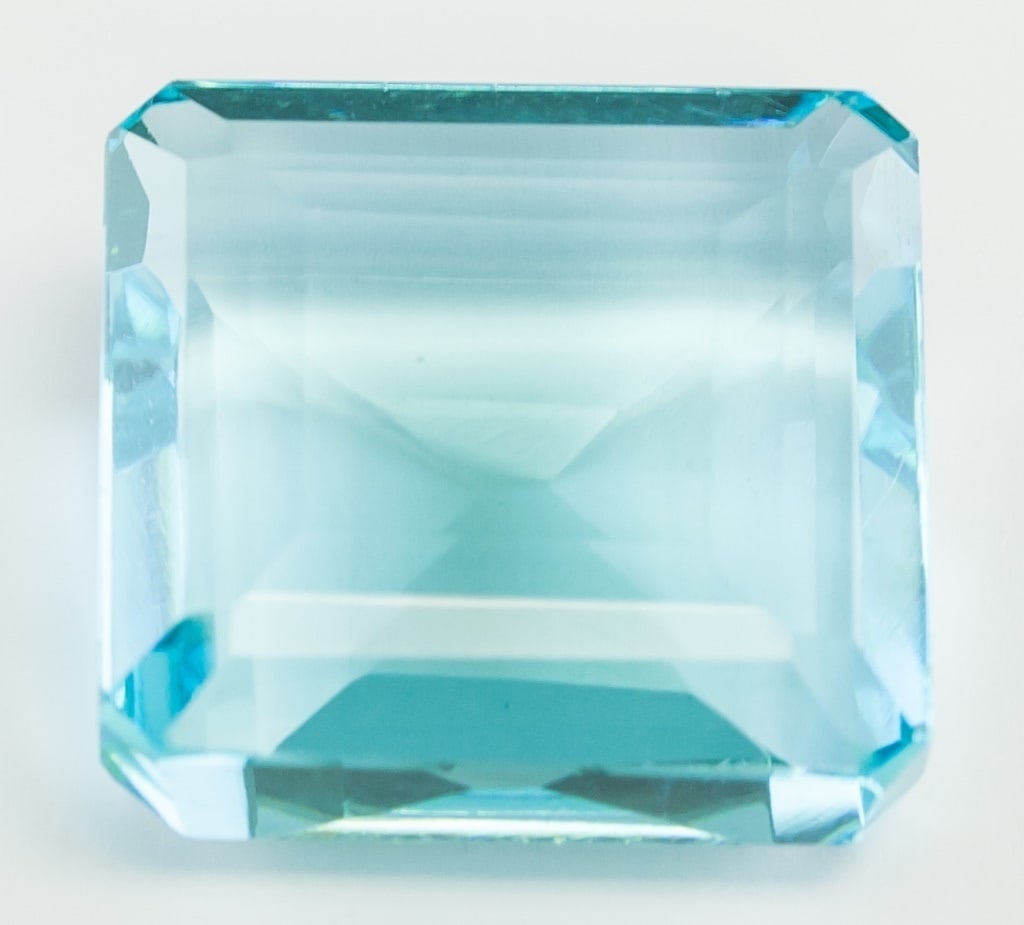 48.75ct Emerald Cut Blue Indicolite Tourmaline GGL: 48.75 ct emerald cut blue INDICOLITE TOURMALINE. Origin: Brazil. Accompanied with a GGL certificate. 22.24 x 21.32 x 11.33 mm