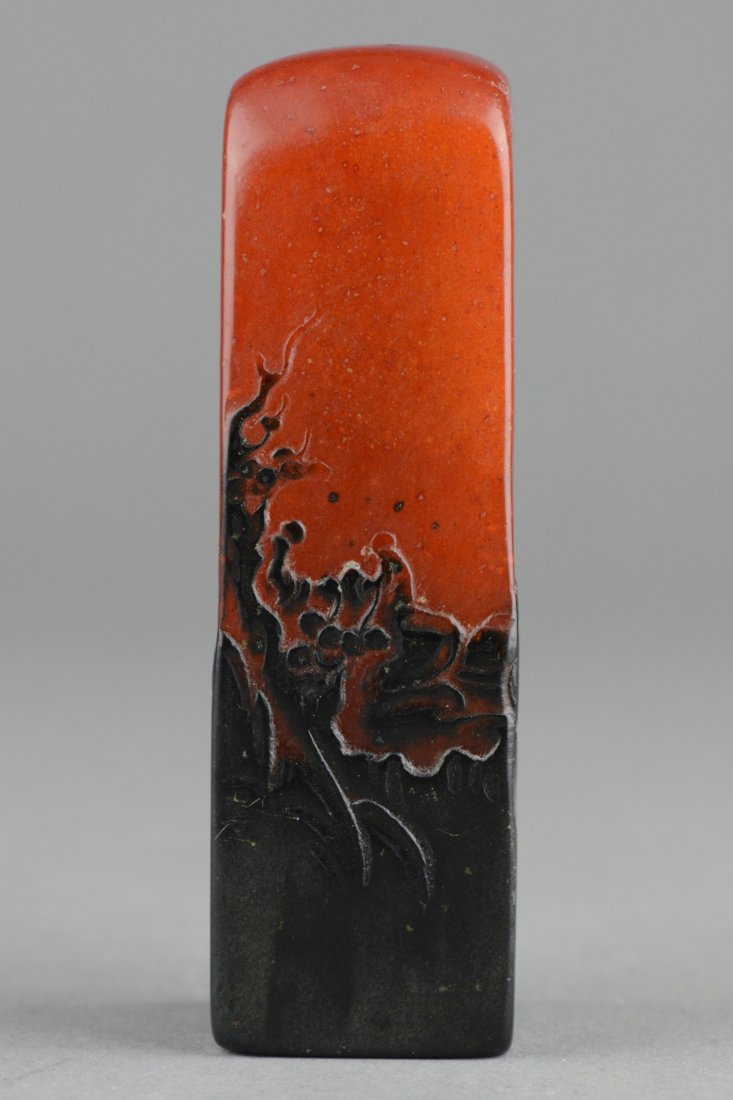 Tianhuang Seal Organ Tone Black Skin: Chinese carved Tianhuang stone seal; of rectangular form with continuous landscape; the stone of dark orange with black skin; H: 7 cm, L: 2 cm, W: 4 cm, 118 grams