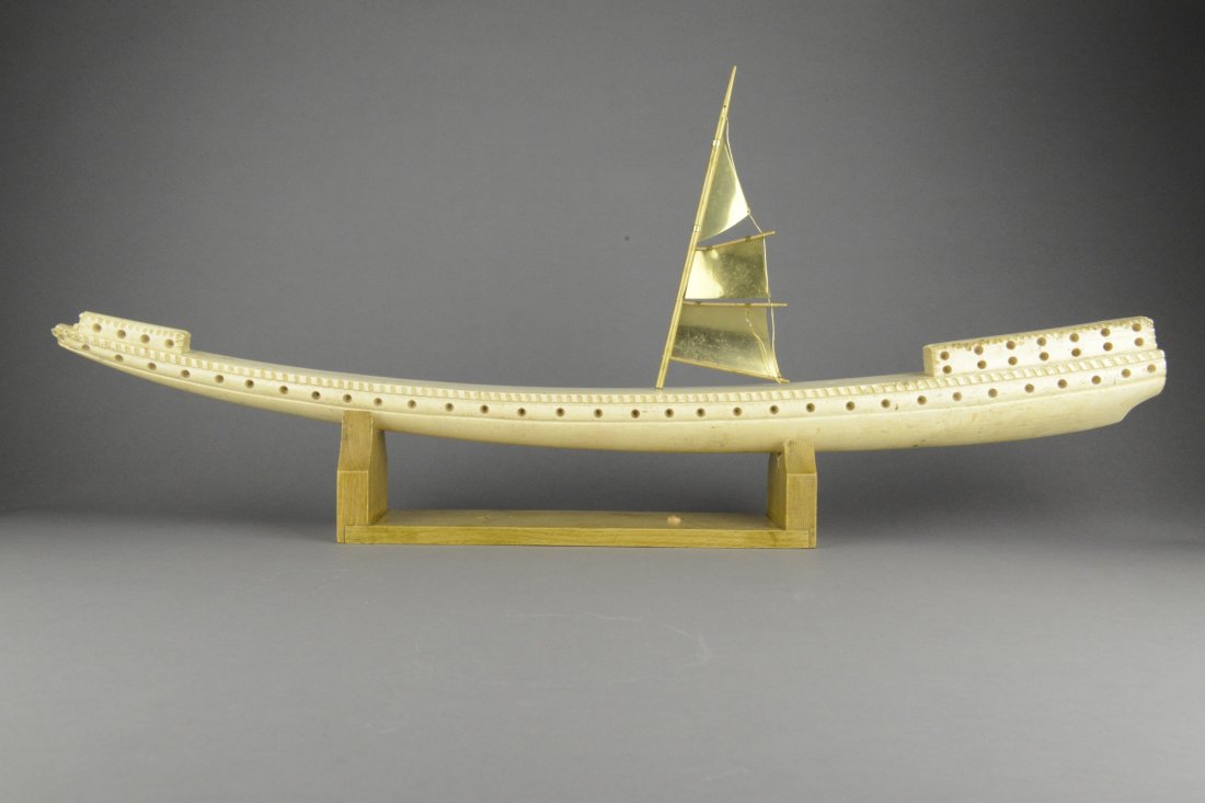 Large Chinese Ivory Carved Boat: Large Chinese carved ivory model of a ancient barge ship with golden sail on wooden base; H 11 cm, L 80 cm, 2587 grams