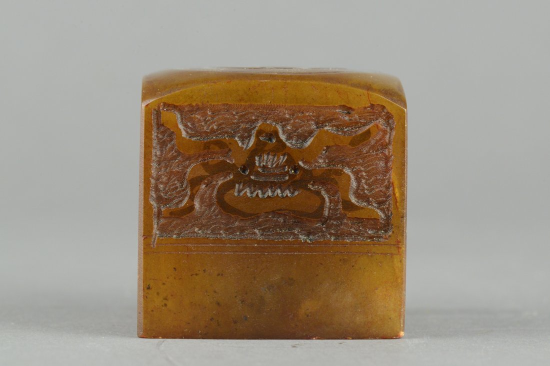 Chinese Tianhuang Stone Seal Qing period: Of cube form, the Tianhuang stone seal is carved with abstract period design on sides and a man on boat on top. Bottom carved with four Chinese characters. Qing Period. H: 5 cm, 330 grams.