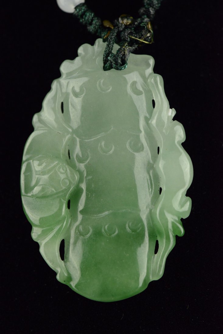 Chinese Jadeite Pendant Bamboo and Bats: Of translucent green, the jade is carved with auspicious bamboo and bats. H: 7 cm, W: 2 cm, 160 grams.